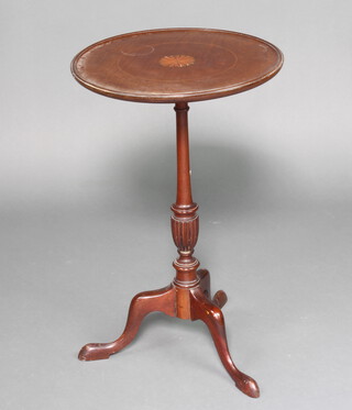 An Edwardian circular inlaid mahogany wine table, raised on a pillar and tripod base 69cm h x 43cm diam. 