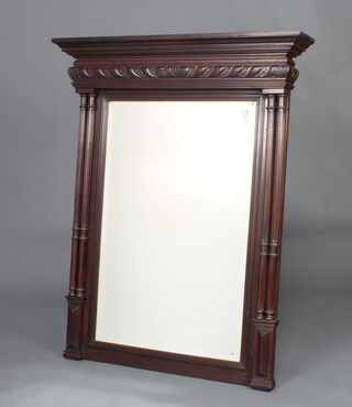 A 19th Century rectangular bevelled plate mirror contained in a carved oak frame with fluted columns to the sides 119cm h x 95cm w 