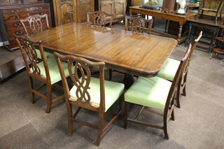 Rackstraw, a Georgian style mahogany dining suite comprising twin pillar extending dining table with 1 extra leaf 76cm h x 112cm w x 186cm l x 232cm l when extended, together with a set of 7 Chippendale style slat back dining chairs with over stuffed seats - 1 carver, 6 standard (1 chair has damage to the slat back) 
