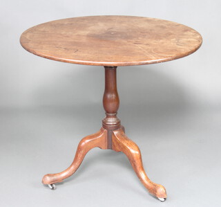 A George III circular mahogany snap top tea table raised on bulbous turned and tripod supports 72cm h x 80cm diam. 