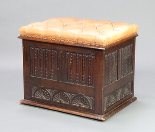 A carved oak ottoman with linen fold decoration and hinged lid, the seat upholstered in brown buttoned leather (formed of old timber) 58cm h x 71cm w x 53cm d 