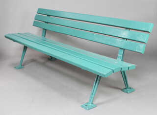 A cast iron and green painted wooden slatted garden bench, base marked BSG8 75cm h x 269cm w x 64cm d 