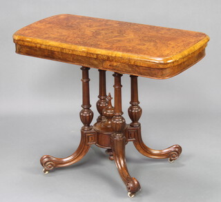 A Victorian burr walnut quarter veneered rectangular card table, raised on 4 columns with tripod base 73cm h x 93cm w x 47cm d 