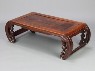 A Chinese rectangular hardwood opium table, raised on pierced scroll supports 31cm h x 99cm l x 47cm w
