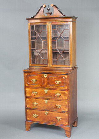 A Georgian inlaid mahogany secretaire bookcase the upper section with broken pediment, fitted adjustable shelves above a well fitted secretaire drawer and 3 long drawers, raised on bracket feet 205cm h x 77cm w x 46cm d 
