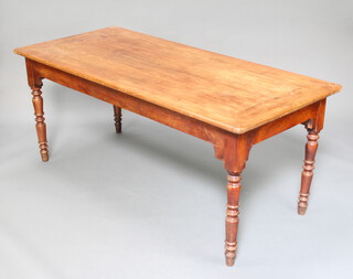 A 19th Century French fruitwood table fitted 2 long drawers, raised on turned supports 74cm h x 180cm w x 79cm d   