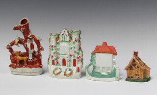 A 19th Century biscuit porcelain pastel burner in the form of a cottage, the base marked 23822 8m x 7cm x 5cm, a porcelain soap stand in the form of a cottage marked Present from Herne Bay 11cm (chip to base), a Staffordshire flat back castle with swans 14cm (chips in places) and a ditto vase decorated arbour and figures 17cm (f) 