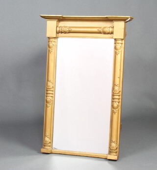 A Regency rectangular plate pier mirror contained in a gilt frame with column decoration 92cm x 59cm x 10cm 