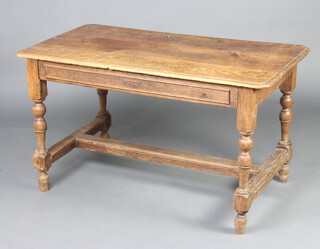 An 18th Century oak side table fitted a frieze drawer, raised on turned and block supports with H framed stretcher 74cm h x 128cm l x 70cm w