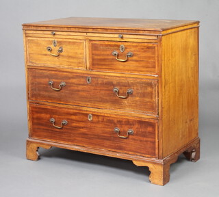 A Georgian mahogany cross banded chest with brushing slide, 2 short and 2 long drawers, raised on bracket feet 84cm h x 92cm w x 50cm d 
