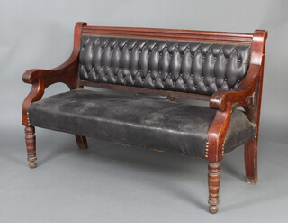 A Victorian mahogany settle, the seat and back upholstered in black rexine, raised on turned supports 100cm h x 152cm w x 56cm w 