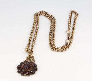 A 9ct yellow gold necklace with a garnet set pendant 22cm 
