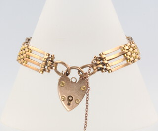 A 9ct yellow gold gate bracelet with heart padlock, 14 grams 