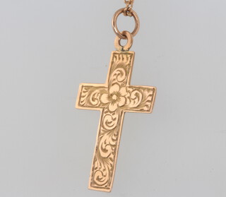 A 9ct yellow gold cross pendant and chain, 3 grams
