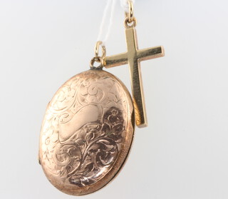 A 9ct yellow gold cross pendant and a gilt locket 