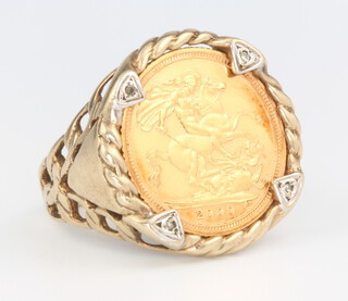 A half sovereign 2000 ring in a 9ct gold mount, mount 3 grams, size U 1/2