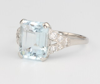 A platinum aquamarine and diamond ring, centre stone approx. 3.25ct surrounded by brilliant cut diamonds 0.3ct, size N