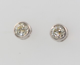 A pair of 18ct white gold brilliant cut diamond ear studs, approx 0.65ct 