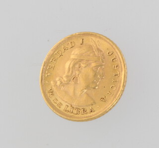 A 1966 half libra coin 1.6 grams 