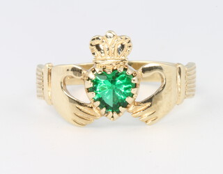 A 9ct yellow gold gem set Claddagh ring size S 