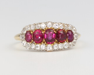 A yellow gold ruby and diamond dress ring, size N
