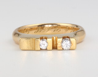 An 18ct yellow gold 2 stone diamond ring, size K, approx. 0.10ct, 6 grams