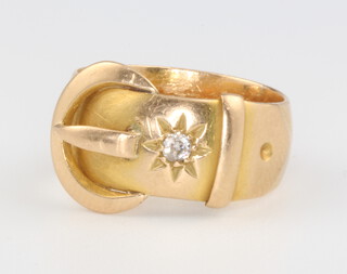 An 18ct yellow gold diamond set buckle ring, size K 1/2, 6.3 grams 