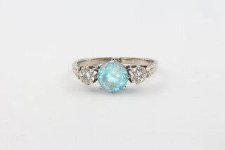 An 18ct yellow gold blue zircon and diamond ring, size O, 2.8 grams