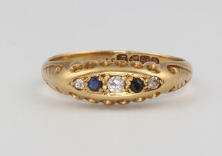 An 18ct yellow gold sapphire and diamond ring, size N, 3 grams