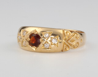 An 18ct yellow gold garnet and diamond ring size Q, 4.1 grams