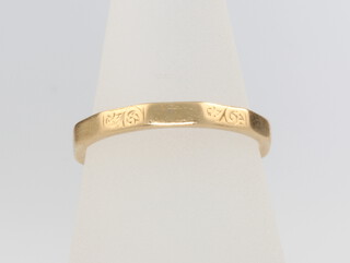 An 18ct yellow gold wedding band, size N, 2.9 grams