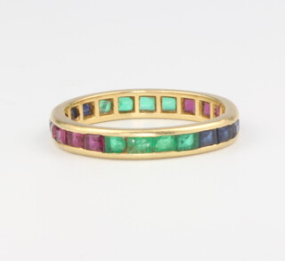 An 18ct yellow gold ruby, sapphire and emerald band, size L 1.9 grams