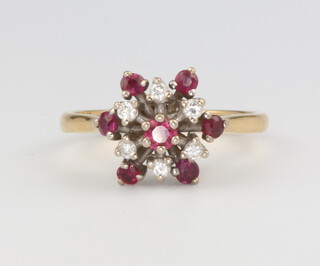 An 18ct yellow gold ruby and diamond cluster ring, size P, 4.3 grams