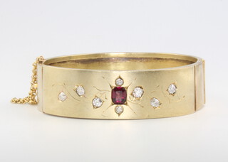A 15ct yellow gold ruby and diamond bangle, 25.1 grams 