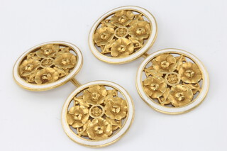 A pair of 18ct yellow gold white enamelled floral cufflinks 6.7 grams 