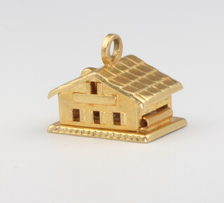 An 18ct yellow gold chalet charm, 2.5 grams