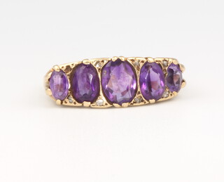 A 9ct yellow gold 5 stone amethyst ring, 4.6 grams, size M