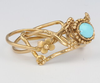 An 18ct yellow gold turquoise puzzle ring, size M, 6.3 grams