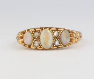 An 18ct yellow gold opal and diamond ring size S 1/2, 4.5 grams 