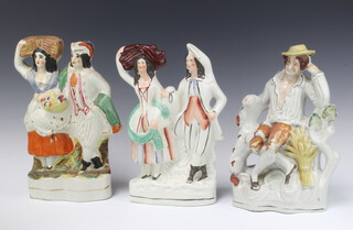 Three 19th Century Staffordshire flatback figures, two farmer and wife 33cm and 31cm and seated farmer 28cm (chip to back) 