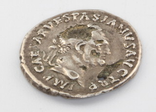 A Roman hammered silvered coin together with a collection of bronze Roman coins 