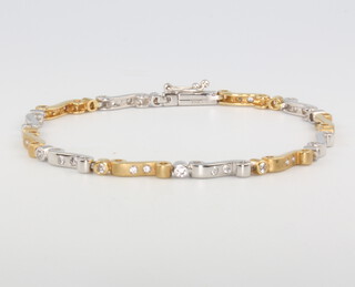 An 18ct yellow gold 2 colour diamond bracelet, 12.7 grams 