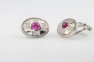 A pair of 18ct white gold cabochon cut ruby and diamond oval cufflinks 16.4 grams 