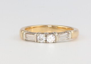 An 18ct yellow gold baguette brilliant cut diamond ring size K 1/2, 3.7 grams