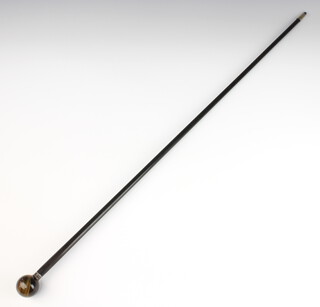 An ebonised walking cane with silver band and "tigers eye" terminal 