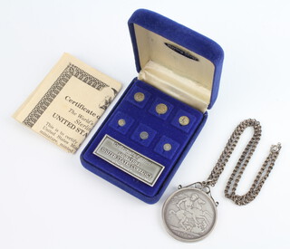A Victorian 1889 crown mounted as a pendant hung on a silver chain, together with a set of 6 American sterling silver miniature coins cased and with certificate 