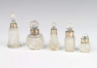 A globular cut glass scent bottle with silver collar 5 cm and 4 others 