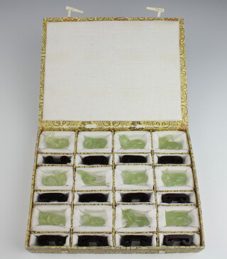 A set of 12 Chinese hard stone figures representing the months of the year contained in a plush case with hinged lid 