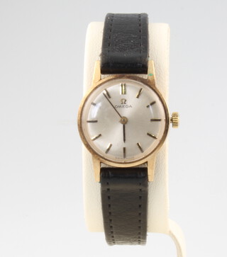 A lady's 9ct yellow gold Omega wristwatch on a leather strap 