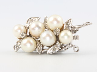 A 14ct white gold pearl and paste clasp
